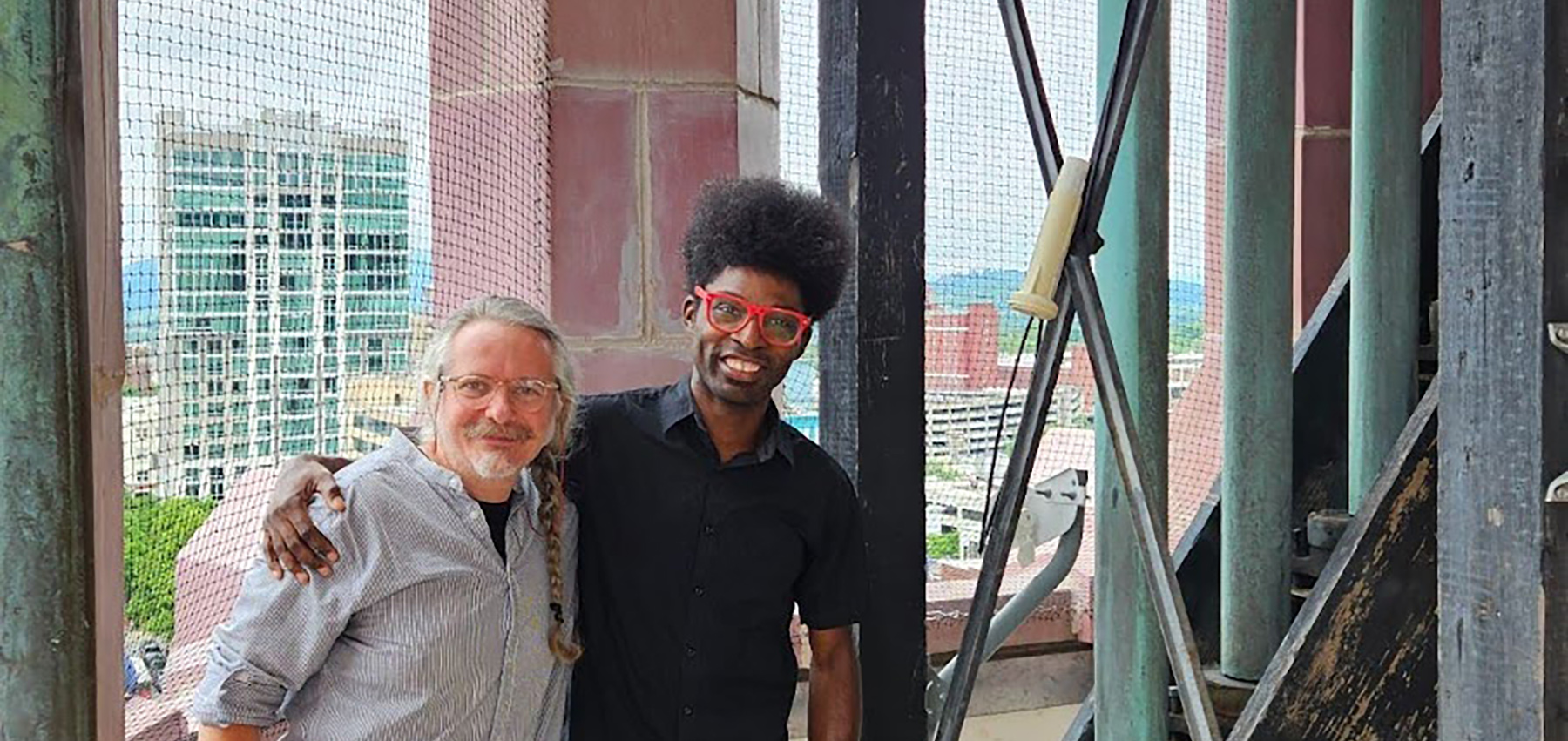 Michael Luchtan and Jamar Woods standing next to the Deagan chimes, photo courtesy of the City of Asheville