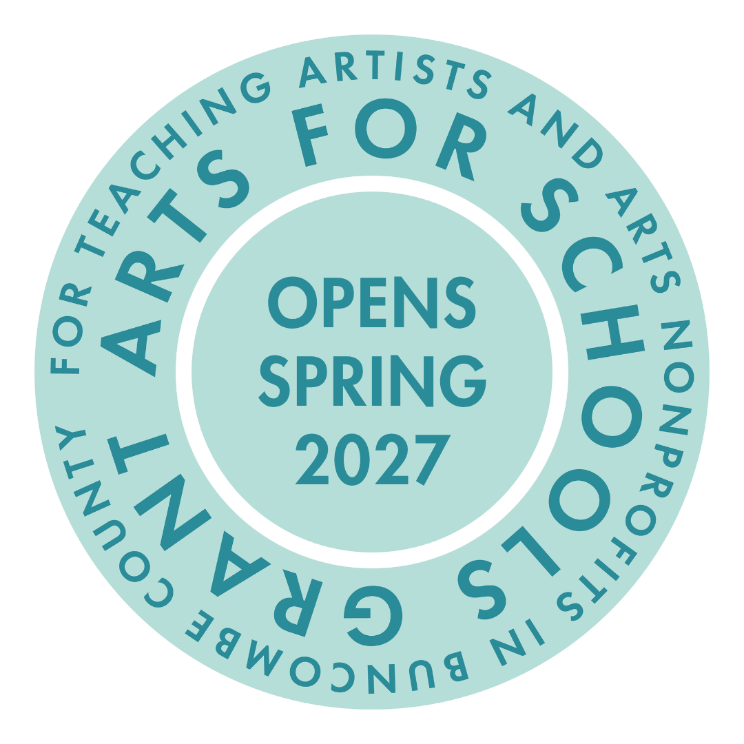 Circular teal badge with a white border, center text reads 'OPENS SPRING 2027'. Outer ring contains teal lettering about arts education.