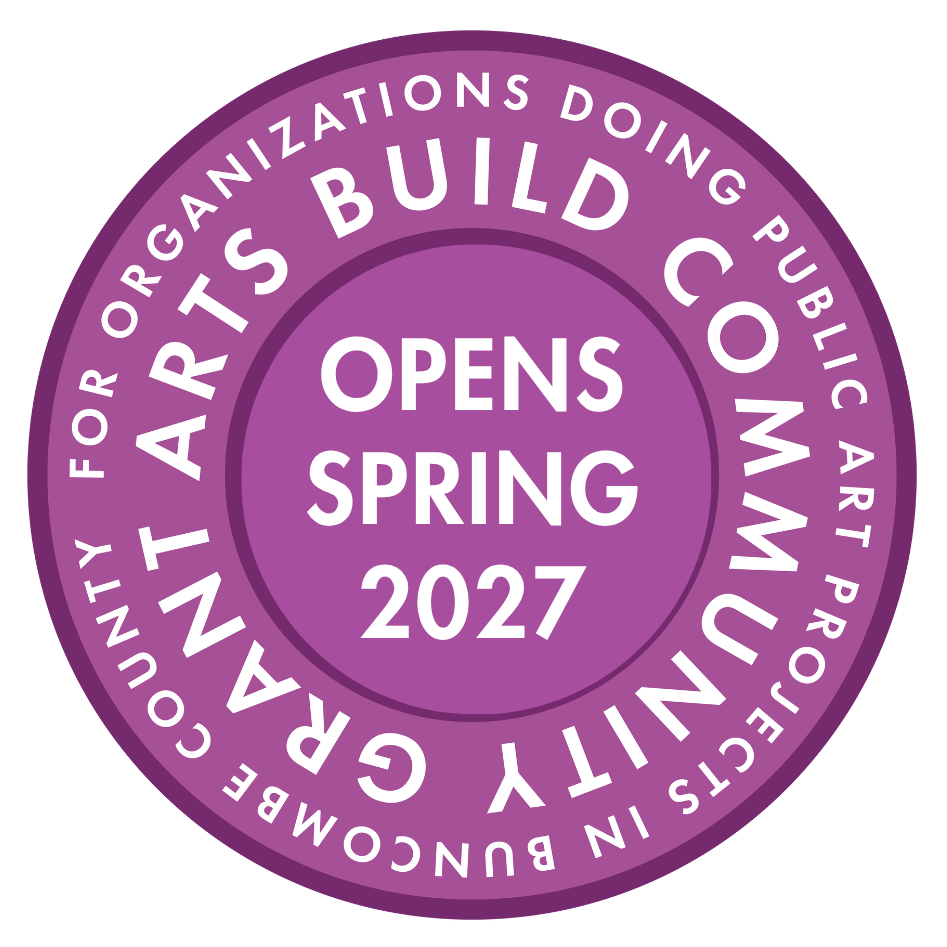 Purple circular badge reading 'OPENS SPRING 2027' with outer ring text about organizations doing public art projects in Buncombe County.
